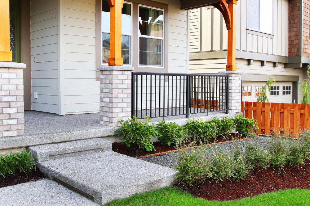 Family home entrance with perfect grass landscaping